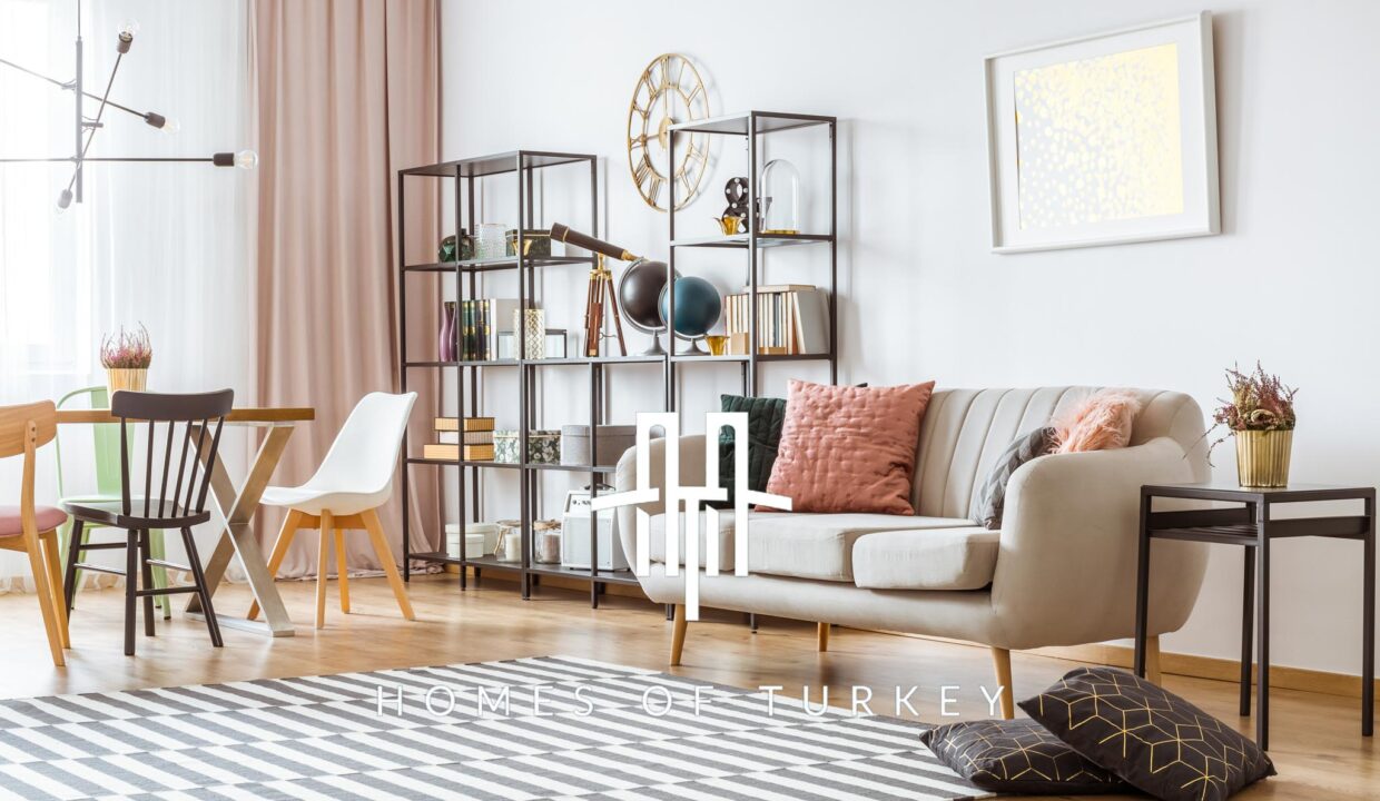 Painting,On,White,Wall,Above,Sofa,With,Cushions,In,Living